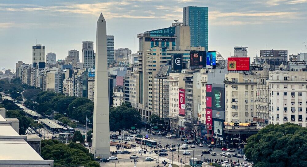 A view of a city with tall buildings and a obelisk